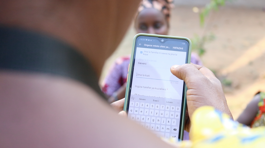 A smartphone shows digitally-enabled health service delivery.