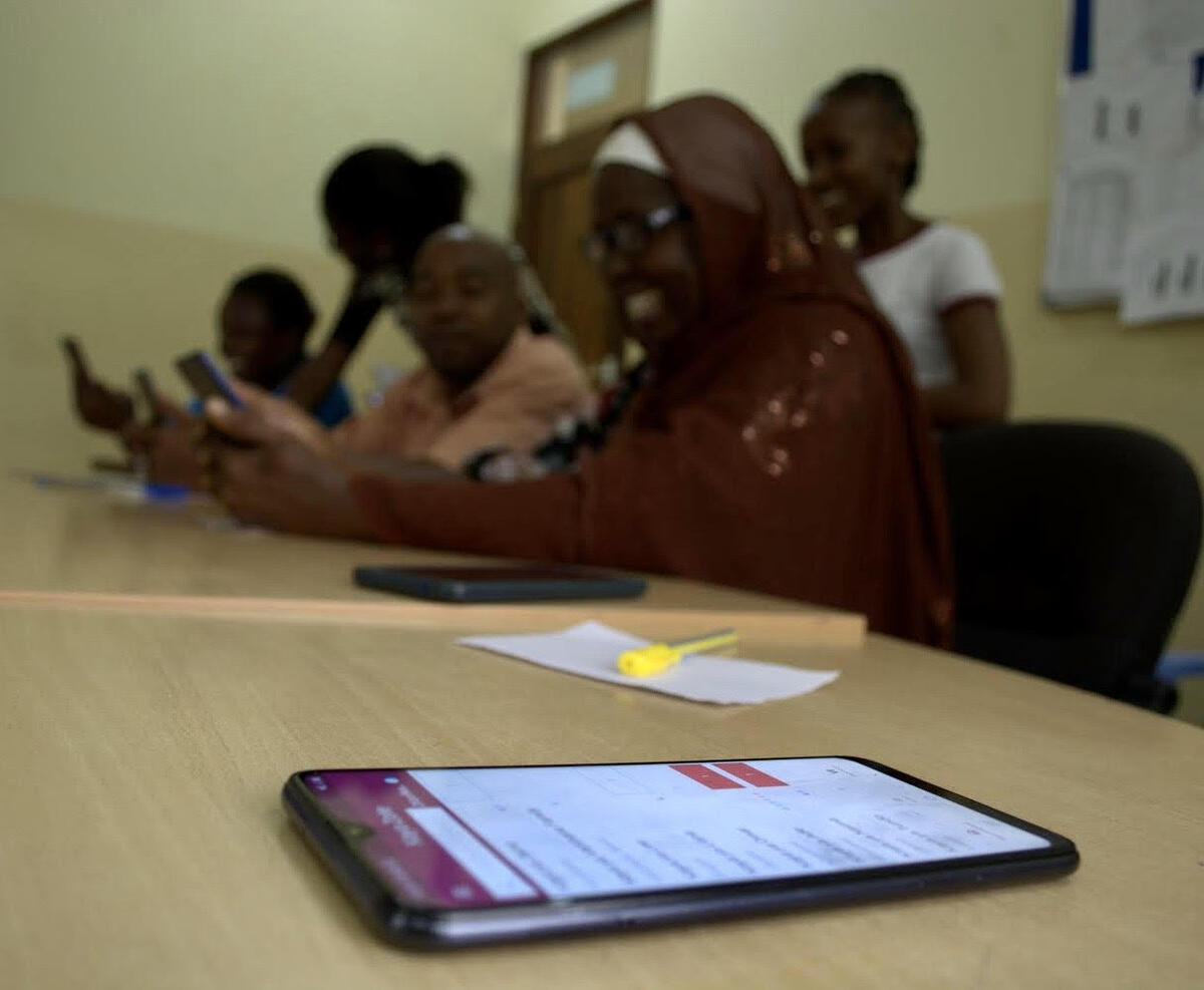 Gloria and her colleague facilitate a workshop with Tanzanian health workers.